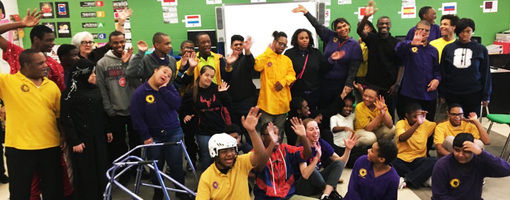 Kay Young's class waving at the "Show and Share" event at the end of her residency